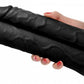 Hand holding the "black" version of this double stuffer dildo.