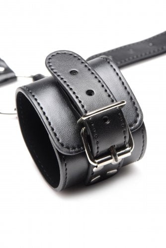 Close-up of one of the wrist cuffs and the buckle hardware.