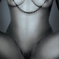 Black and white ad for the Fetish Fantasy Series Nipple and Clitoral Jewelry from Pipedreams (black).