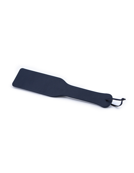 Side angle view of the Bondage Couture Paddle from NS Novelties (blue).