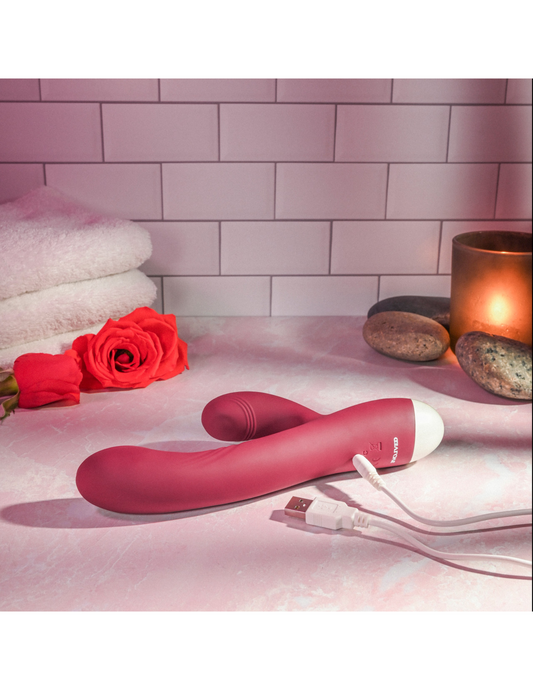 Photo shows the Double Tap G-Spot Vibrator by Evolved with its USB charging cord.