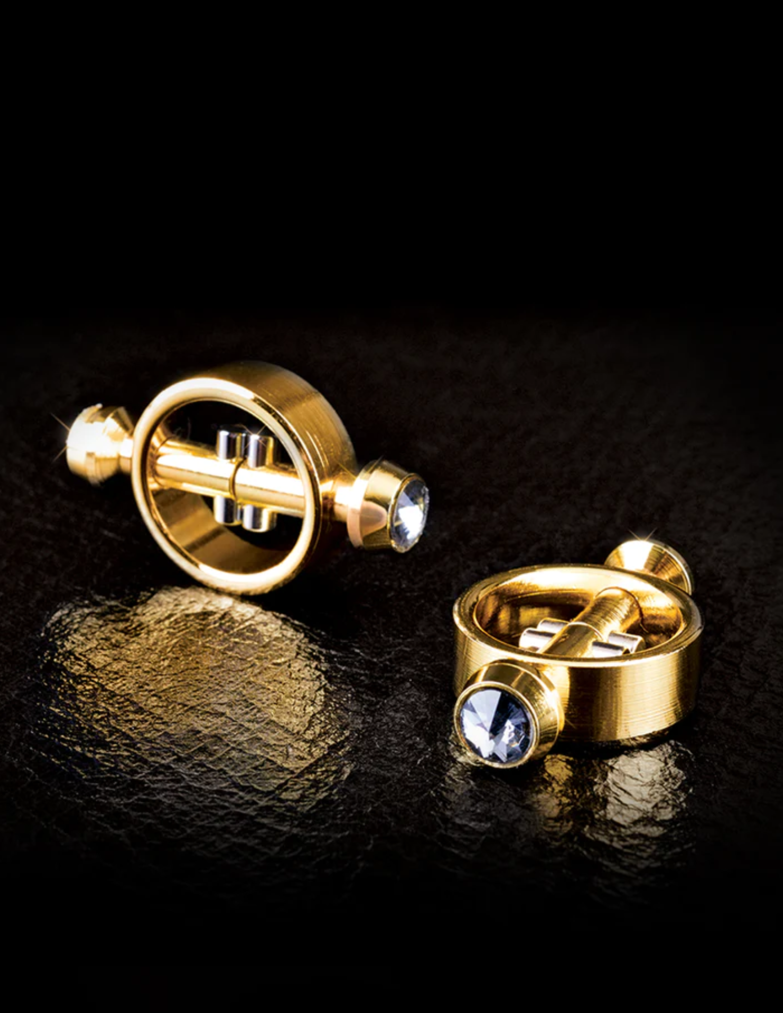 Photo shows the Fetish Fantasy Gold Magnetic Nipple Clamps from Pipedreams shows the gem accents as well as the sturdy gold hardware.