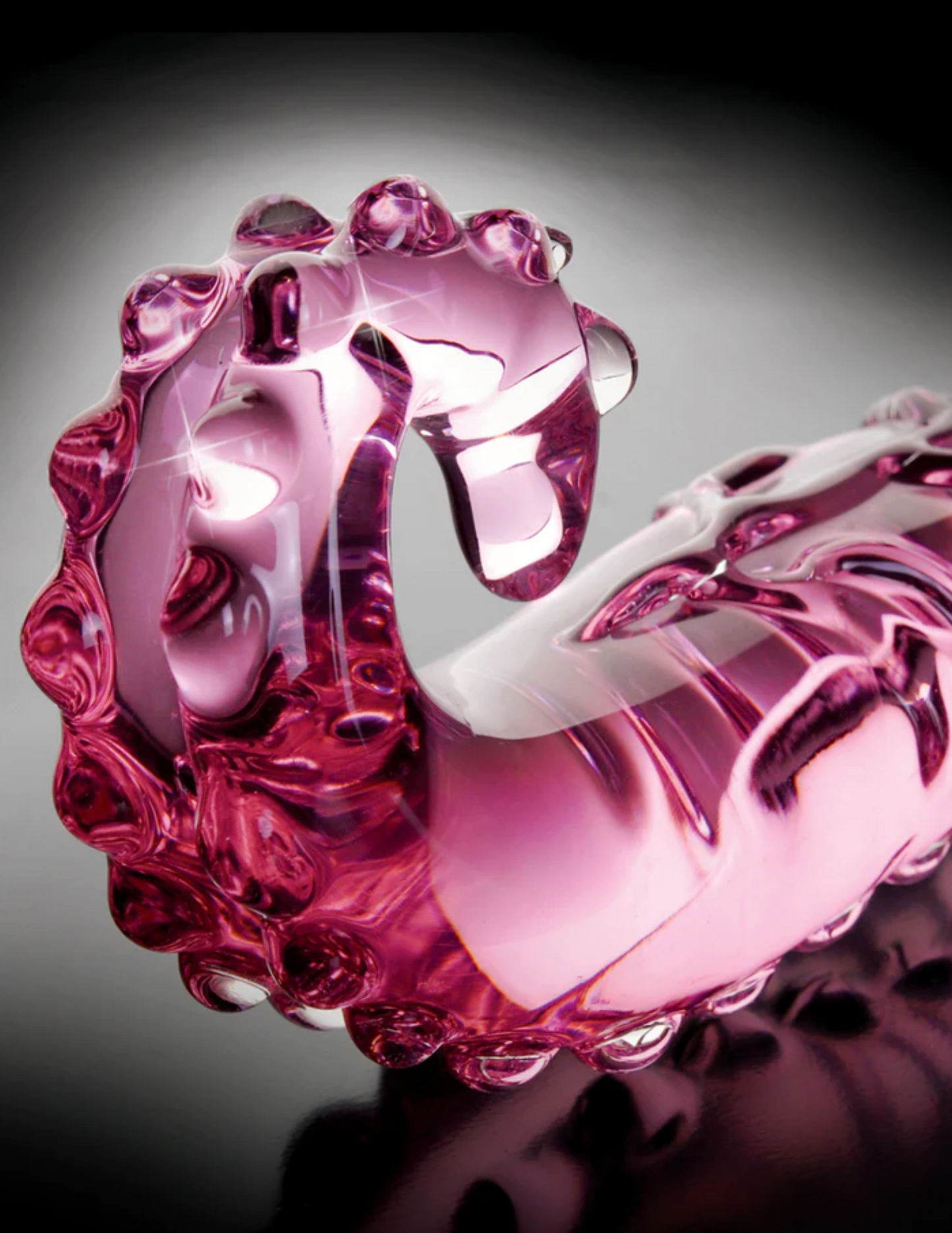 Close-up of the end of the Icicles No 24 Textured Glass Dildo from Pipedreams (pink).
