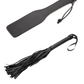 Image features the paddle and flogger from the Master of Kink PU Leather Deluxe Bondage Set by Master Series and XR Brands.
