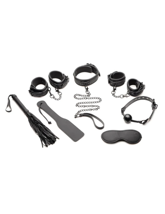 Image of the 7 piece set which includes: flogger, paddle, wrist cuffs, ankle cuffs, gag, blindfold, collar and leash.