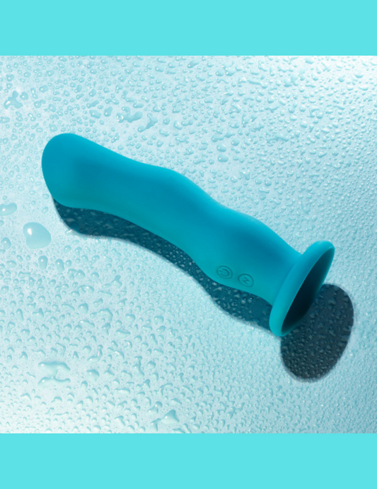 Ad for the Impressions Miami Vibrator from Blush (teal) shows its waterproof capability.