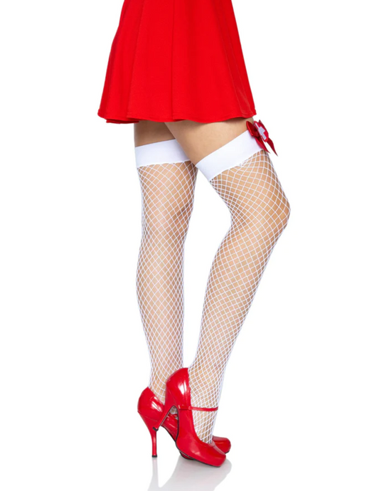 Leg Avenue nurse themed white industrial net thigh high stockings with red bows and white crosses. Side view shown with red shoes and red skirt.