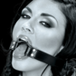 Ad for the Fetish Fantasy Series O-Ring Gag from Pipedreams shows it being worn on a model.