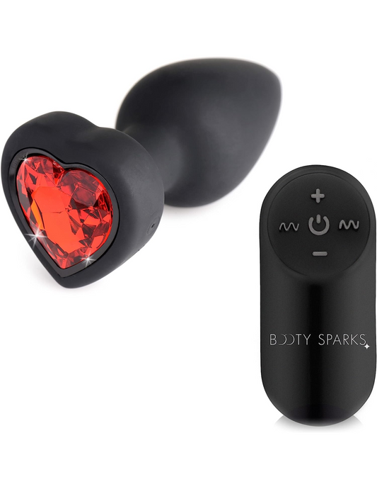 Image shows the Vibrating Heart Gem Anal Plug and Remote out of the package on a white background.