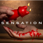 Fox Drip candle ad showing the lit candle dripping hot wax onto a hand, says "sensations".