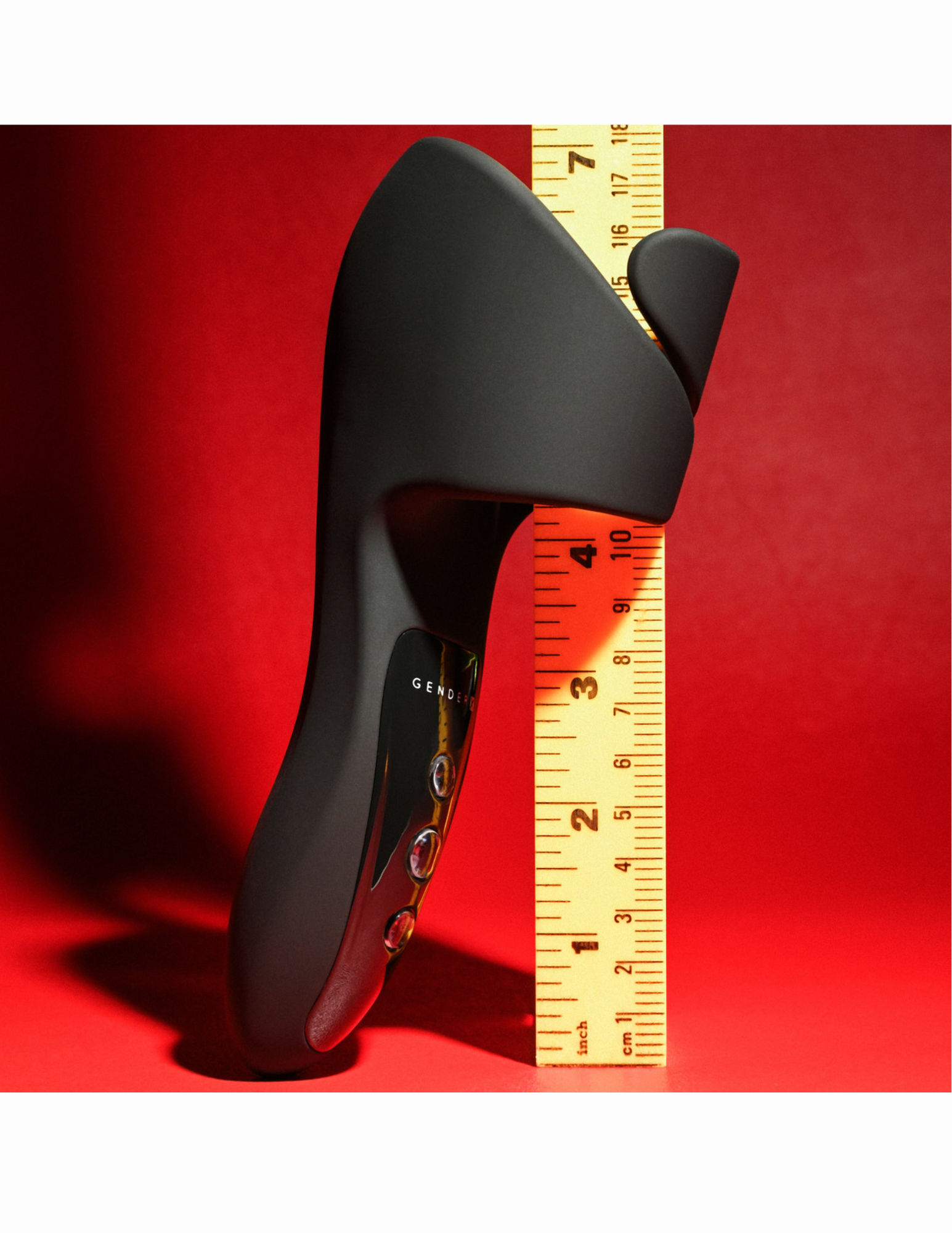 Front view of the Evolved Gender X Embrace Vibrating Stroker shows its size with ruler.