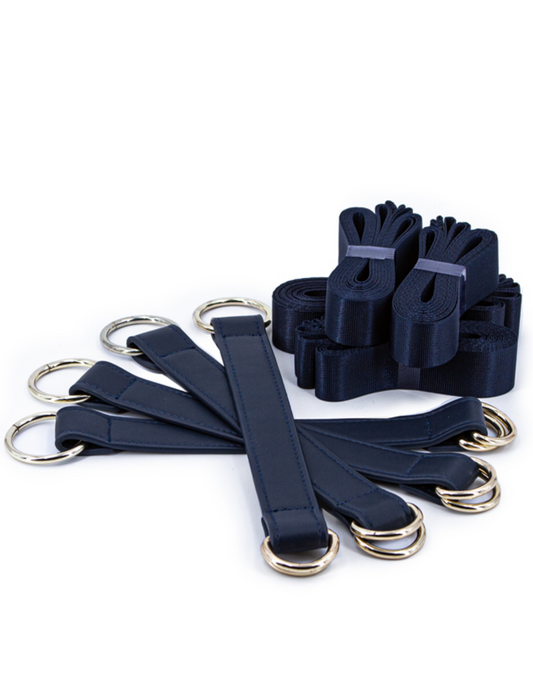 Image shows the buckles and strap bundles that come with the Bondage Couture Tie Down Straps from NS Novelties (blue).