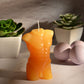 Photo ad of the LaCire Torso Candle from Sportsheets (form 4/gold) male form.