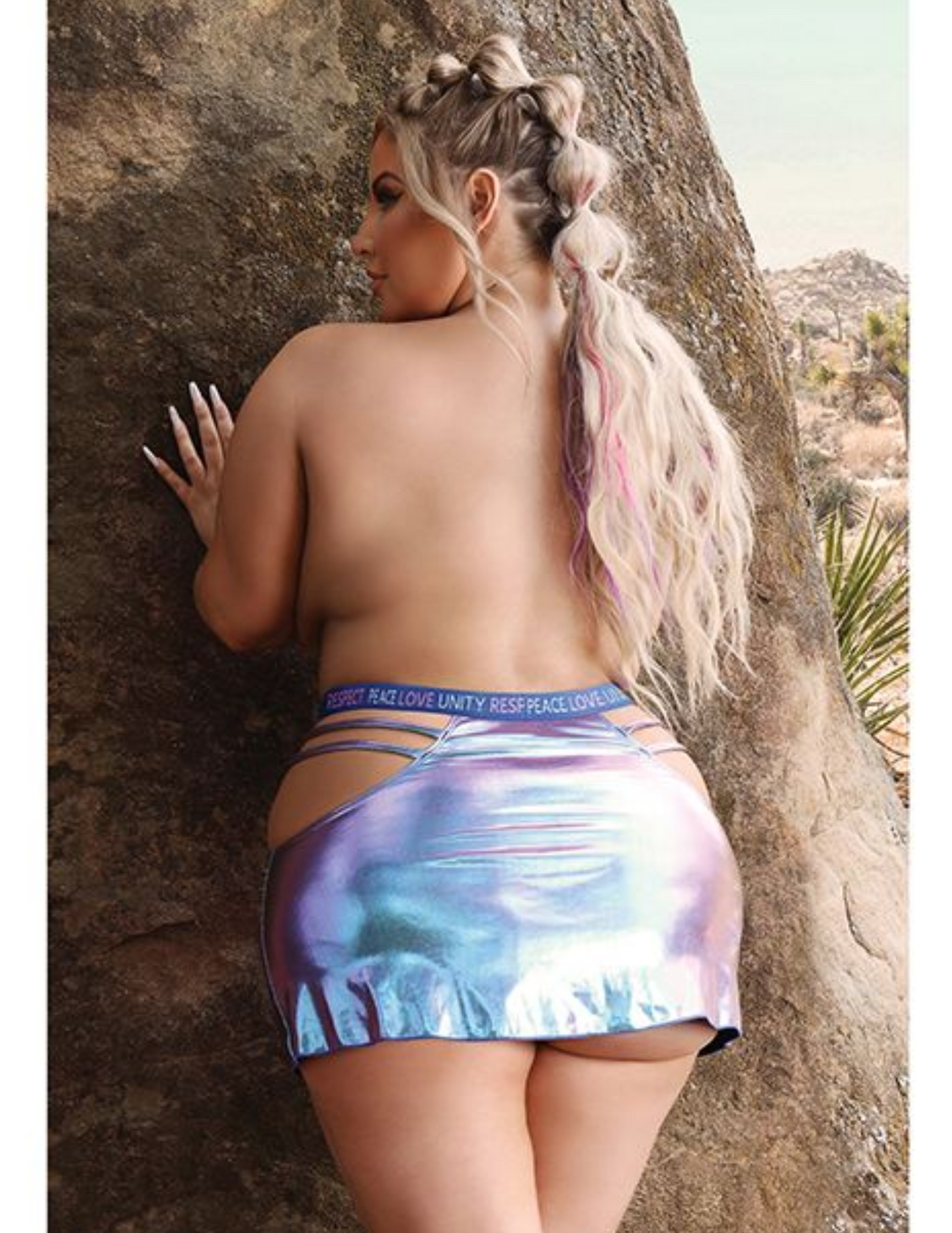 Ad shows the back of the Vibes Plur Iridescent Skirt from Fantasy Lingerie (QN).
