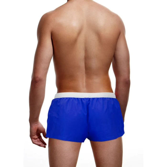 Photo of the back of a model wearing the Prowler Swim Trunks (blue).