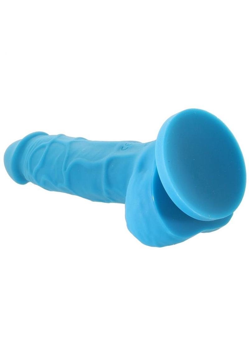 Back angle view of the Colours Pleasures Silicone Vibrating Dildo from NS Novelties (5in/blue) shows its strong suction cup.