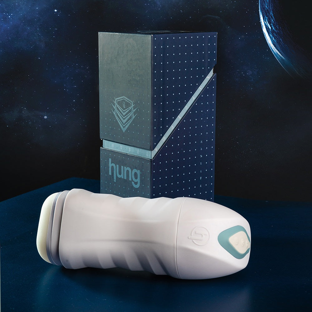 Photo of the UFO Rechargeable Vibrating Stroker, from Hung, along with its box.