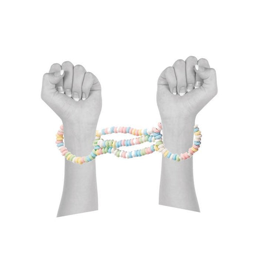 Front view of a pair of arms wearing the candy cuffs on the wrists.