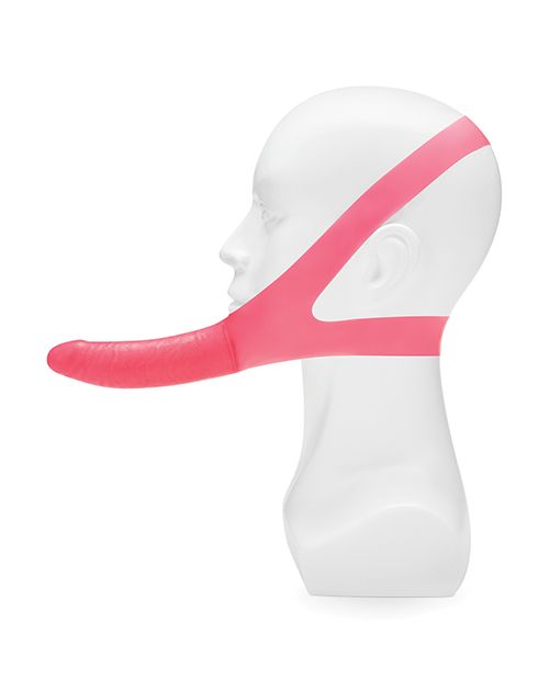 Profile view of the The Original Facilitator Face Strap-On w/ Dildo from Lux Fetish/Electric Novelties (pink) on a mannequin head.