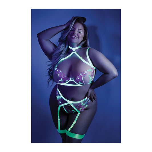 Front view photo of a woman wearing the 2pc set in a black light room (queen).