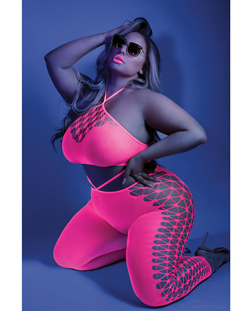 Photo of a woman in a black light room wearing the 2pc set (queen).