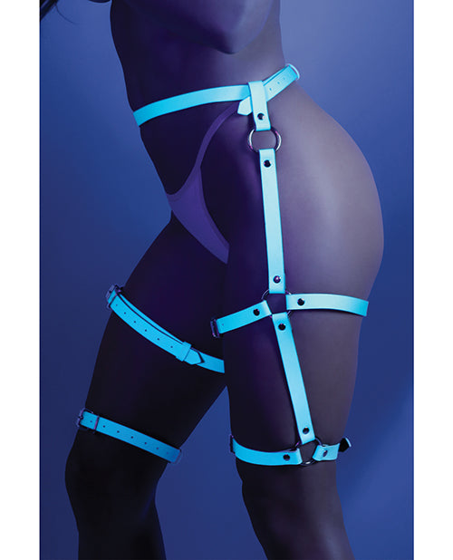 Photo of the back of a model wearing the f a model wearing the Glow Buckle Up Glow in the dark Leg Harness (light blue) by Fantasy Lingerie (panties not included).