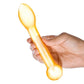 Photo of a hand holding the toy up-right to show the different sizes of the ends of the wand.