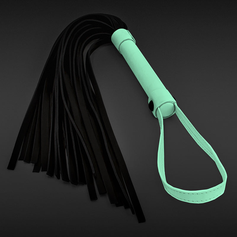 Photo shows the Glo Bondage Flogger from NS Novelties glowing in the dark,