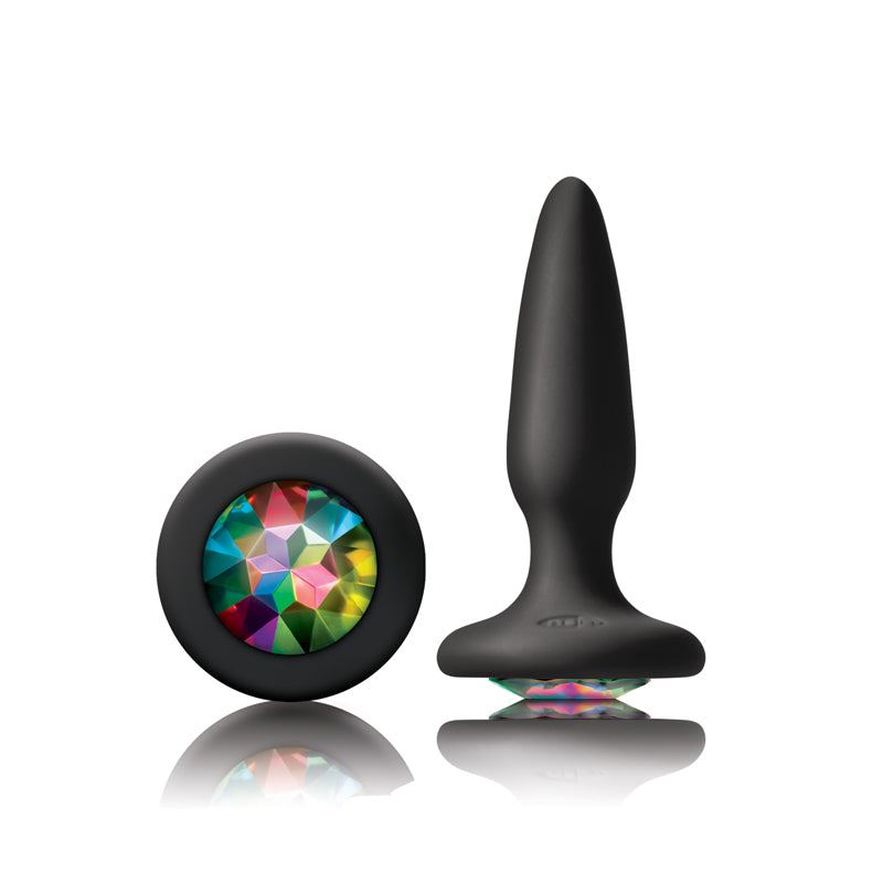 Photo of the Glams Mini Silicone Butt Plug from NS Novelties (black/rainbow), shows the large gem on the base and the tapered shape of the plug.