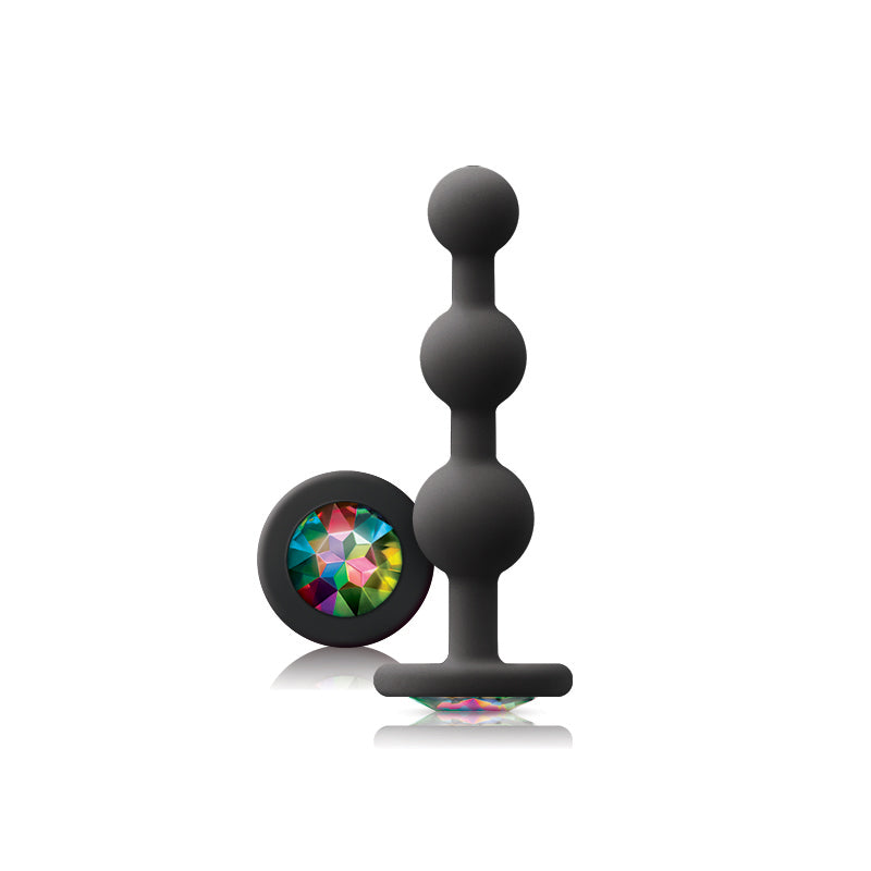 Photo of the Glams Ripple Silicone Beaded Plug from NS Novelties (black/rainbow) shows its colorful gem base and tapered beads for maximum pleasure.
