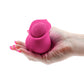 Photo of a hand holding the Inya The Bloom from NS Novelties (pink) to show its comfortable size.