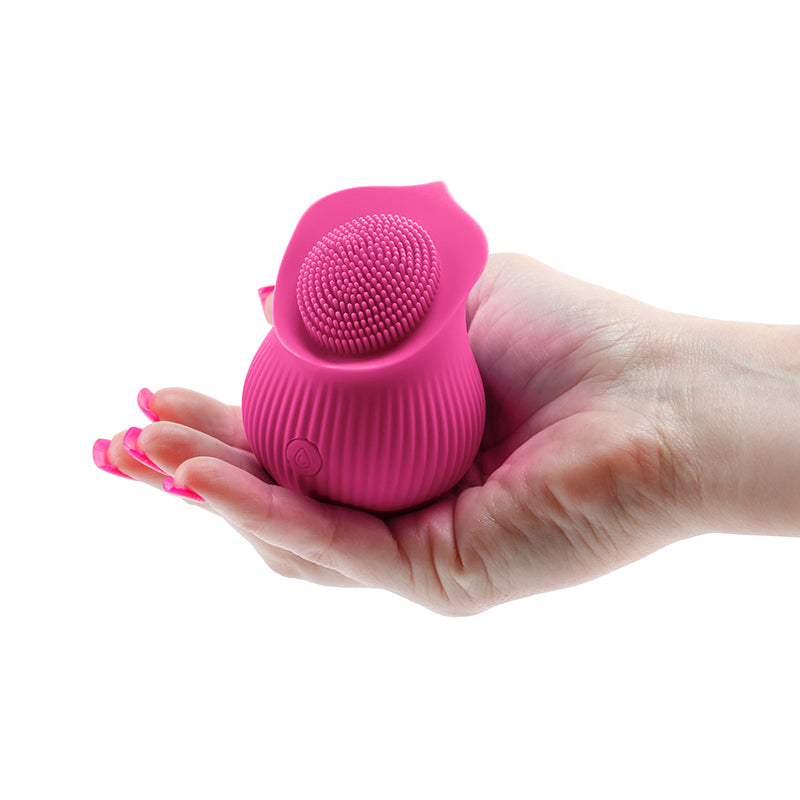 Photo of a hand holding the Inya The Bloom from NS Novelties (pink) to show its comfortable size.