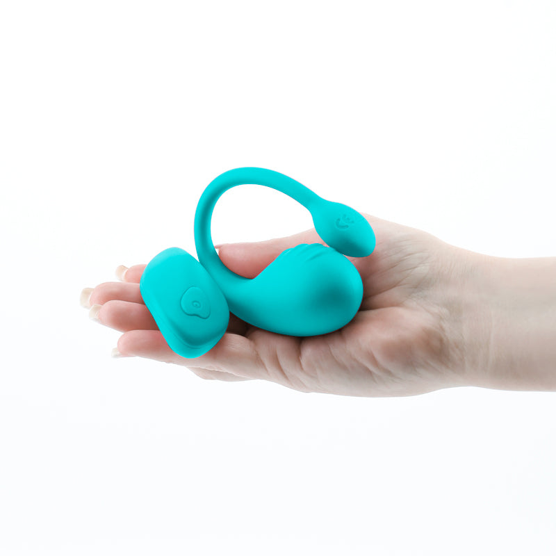 Photo of a hand holding the Inya Venus from NS Novelties (teal) shows its small size as well as its control buttons.
