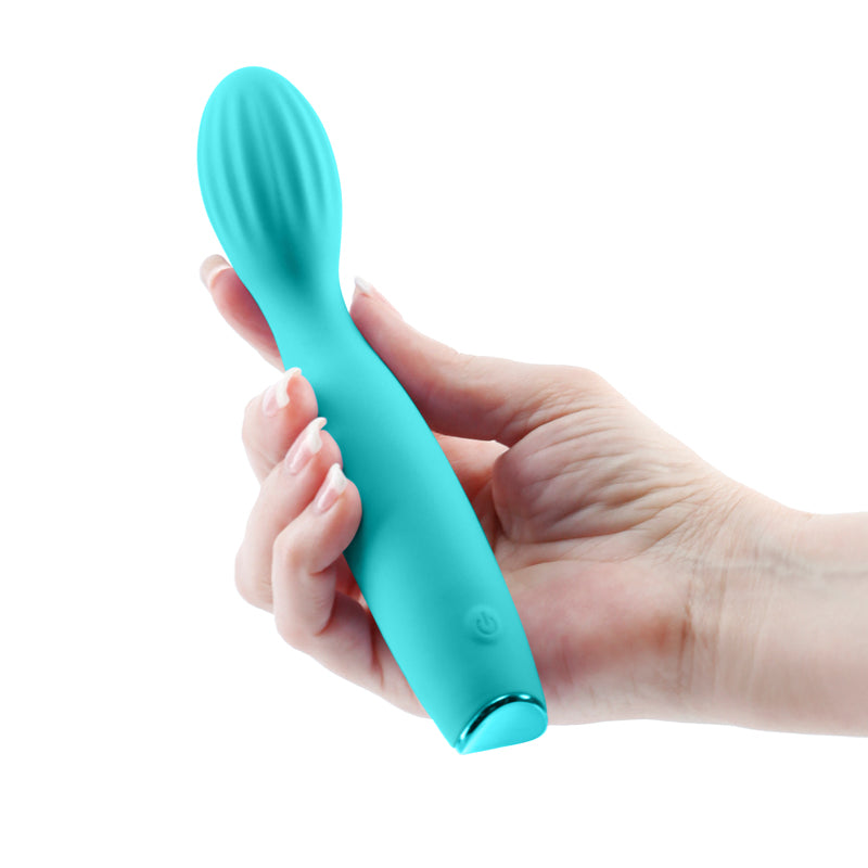 Photo of a hand holding the Revel Pixie G-Spot Vibrator from NS Novelties (teal) shows its slim design and petite shape.