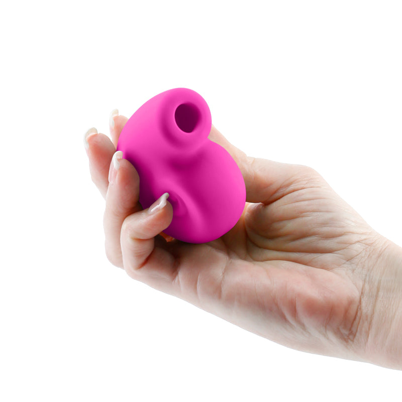 Photo of a hand holding the Revel Starlet from NS Novelties (pink) shows its size by comparison.
