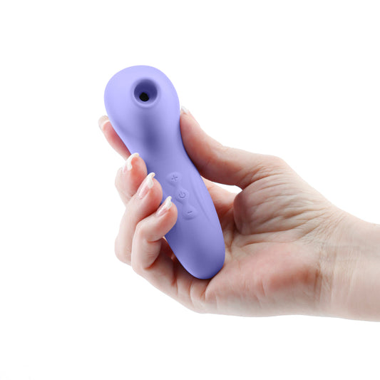 Photo of a hand holding the Revel Vera Air Pulse from NS Novelties (purple) shows its size by comparison.