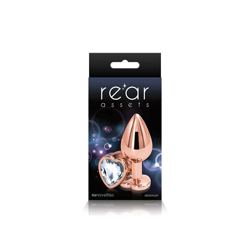 Photo of the front of the box for the Rear Assets Heart Anal Plug w/ Gem (rose gold/clear) from NS Novelties.