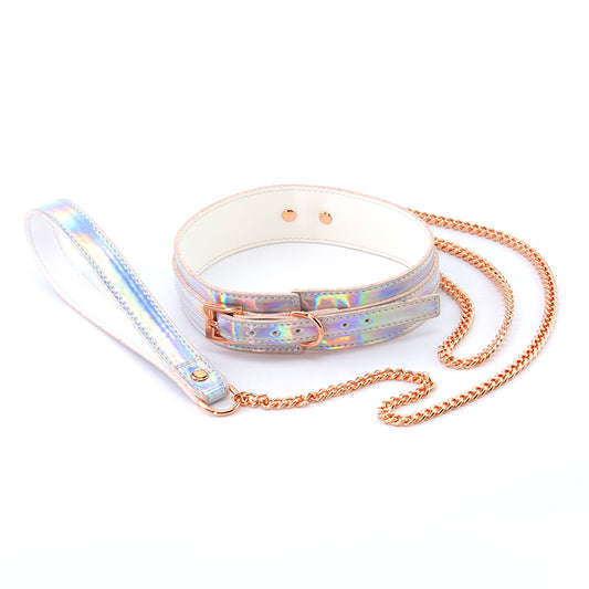 Top angle view of the Cosmo Bondage Collar and Leash from NS Novelties shows its rose gold chain and hardware.