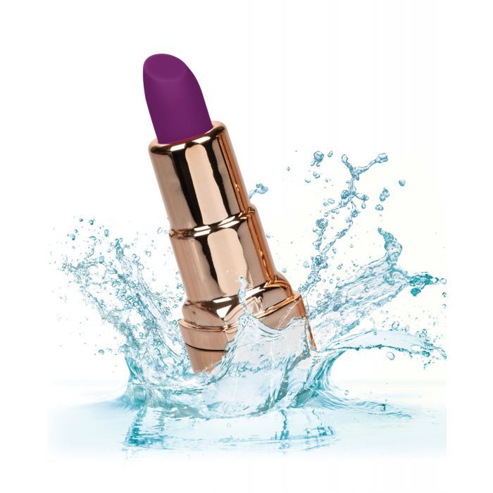 Photo of the Naughty Bits Bad Bitch Lipstick Bullet Vibrator, from CalExotics, splashing in water to show its waterproof capability.