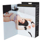 Photo of the cover of the box open showing an ad with a woman lying on a bed using the product.