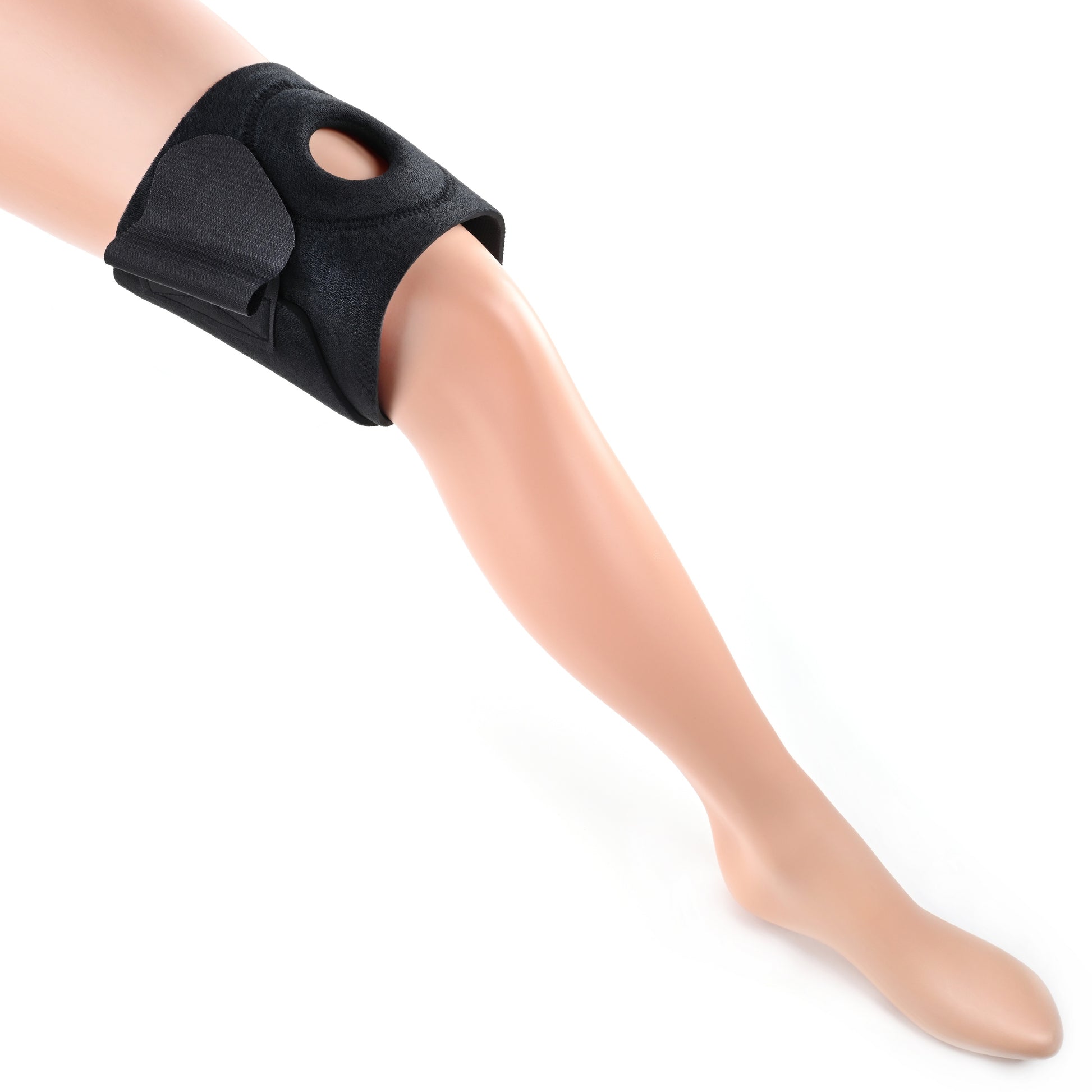 Photo of a mannequin leg wearing the thigh harness without a dildo attachment. 
