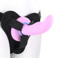 Close-up of the bottom portion of a mannequin wearing a harness with a dildo and using one of the O-rings (periwinkle).