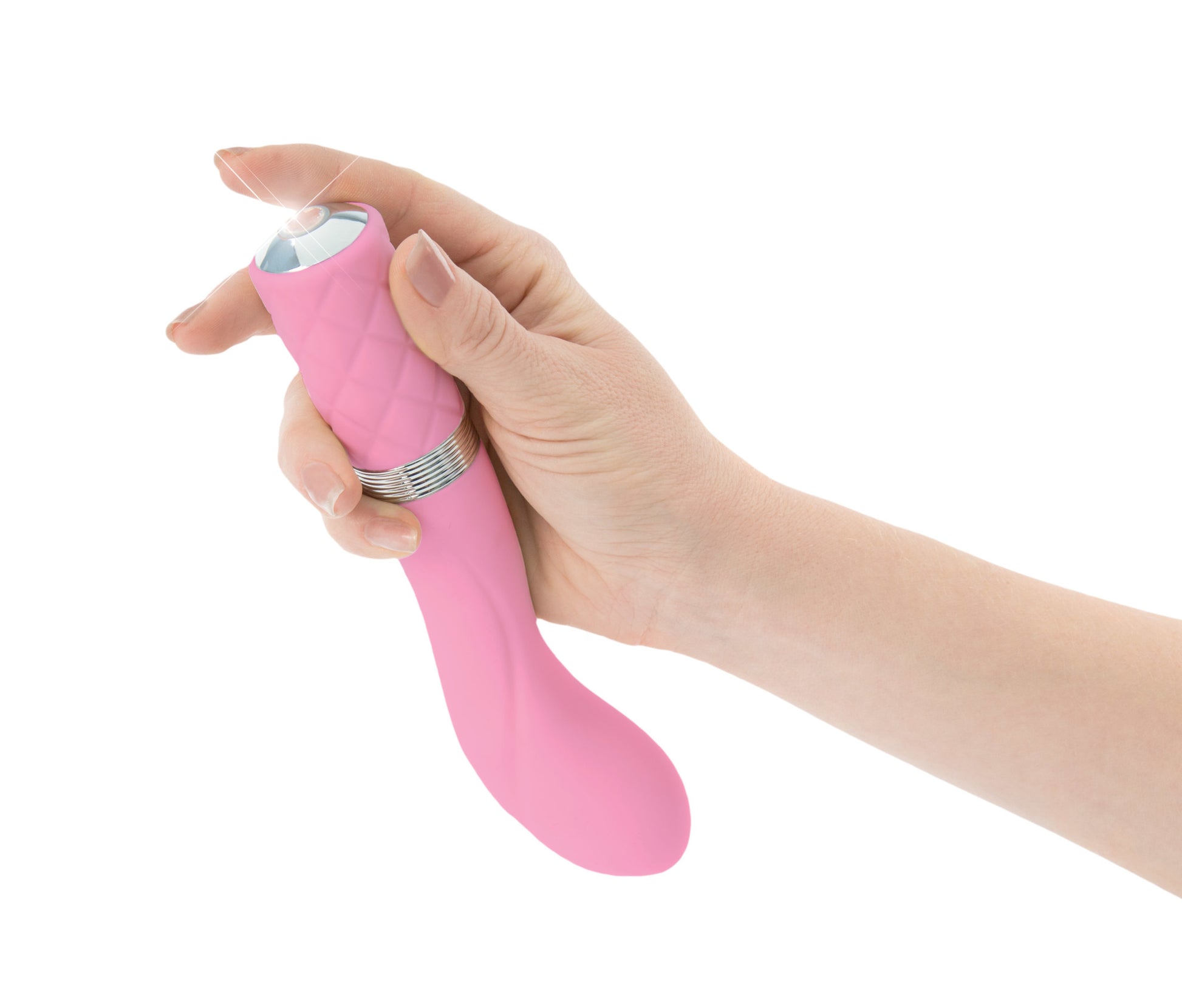 Photo shows a hand holding the vibrator and turning it on with the gemstone power button.