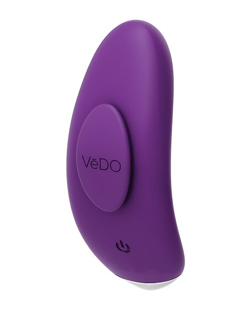 Side angle view of the panty vibe showing the power button and magnetic stay put clip (purple).