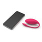 Photo shows the Jive from We-Vibe (pink) next to a smartphone.