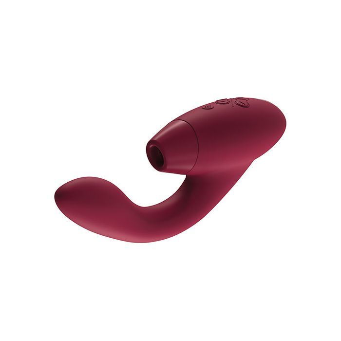 Front side angle view of the Duo showing its clitoral opening, flexible G-spot stimulator, power and control buttons located on the top, hand-held portion of the toy (bordueax).