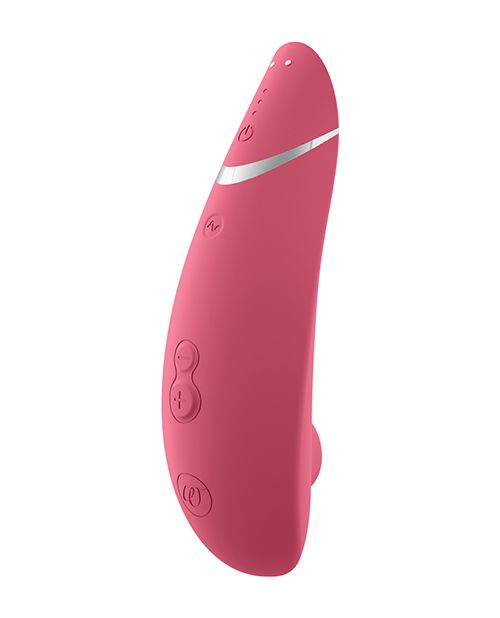 Up-right image of the toy showing its magnetic charging pins as well as the control buttons and ergonomic shape (raspberry).