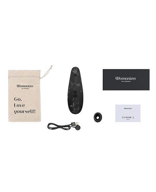 Image shows what comes with the Premium 2: air pulse toy, instruction manual, magnetic USB charging cord (marble black).