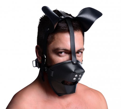 Left side angle view of a man wearing the puppy mask.