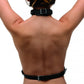 Photo of the back of a woman wearing the chest harness and the backstrap.